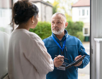 Man At Front Door Asking Questions