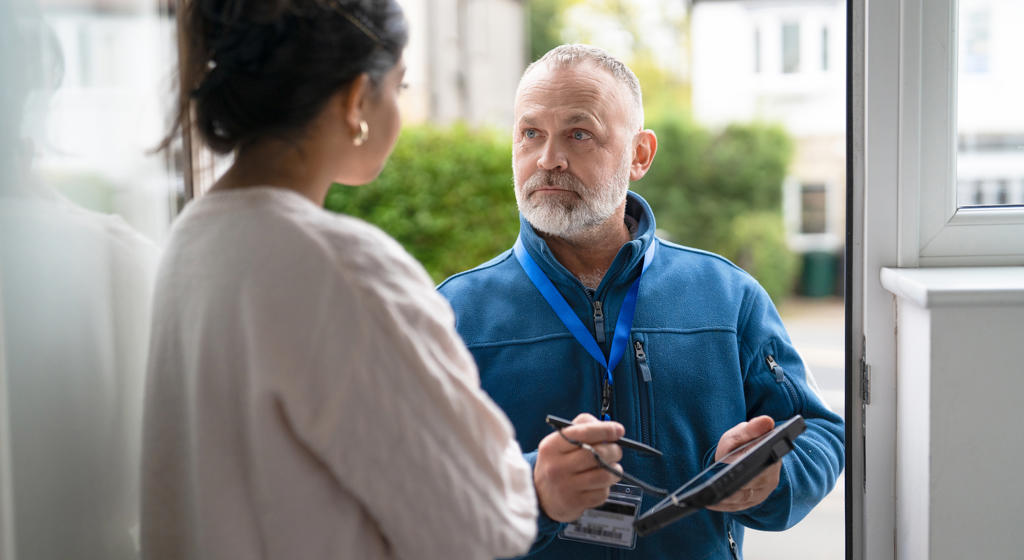Man At Front Door Asking Questions