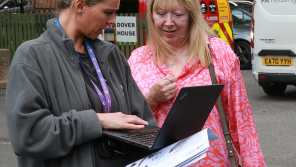 A person conducting a survey with a resident