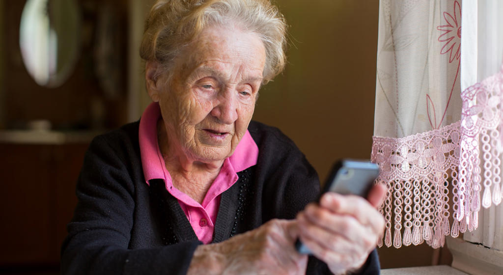 Elderly woman on smartphone  - stock