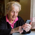 Elderly woman on smartphone  - stock