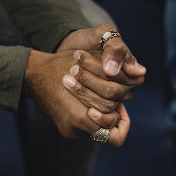 close up of people holding hands