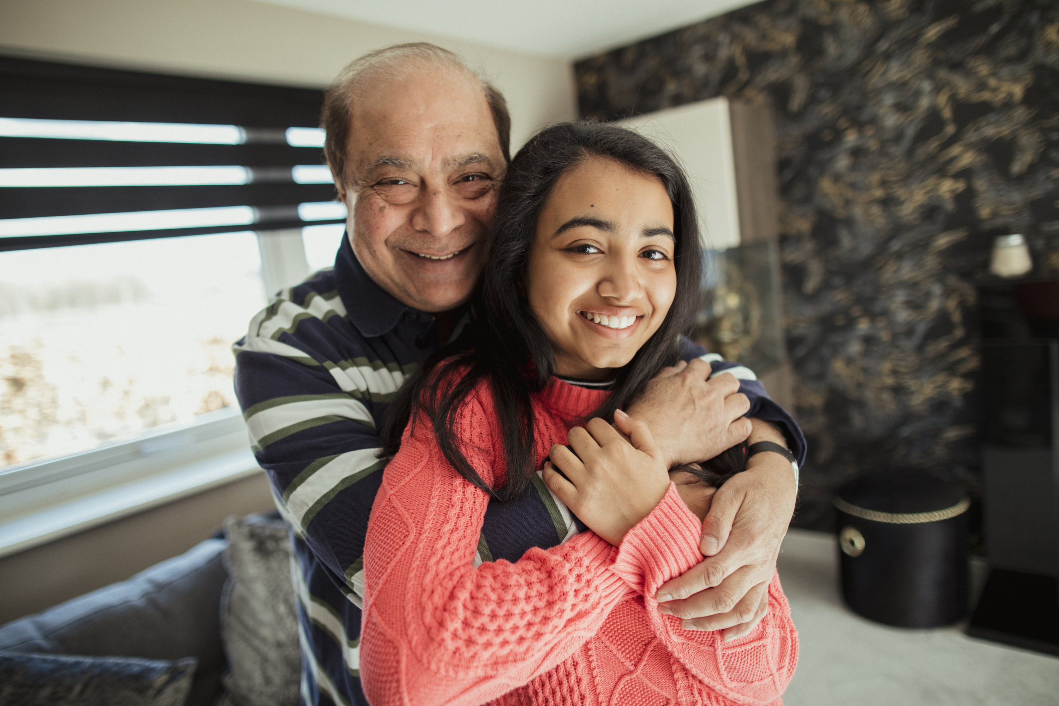Asian father and daughter at home