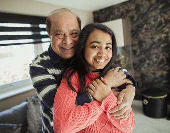 Asian father and daughter at home