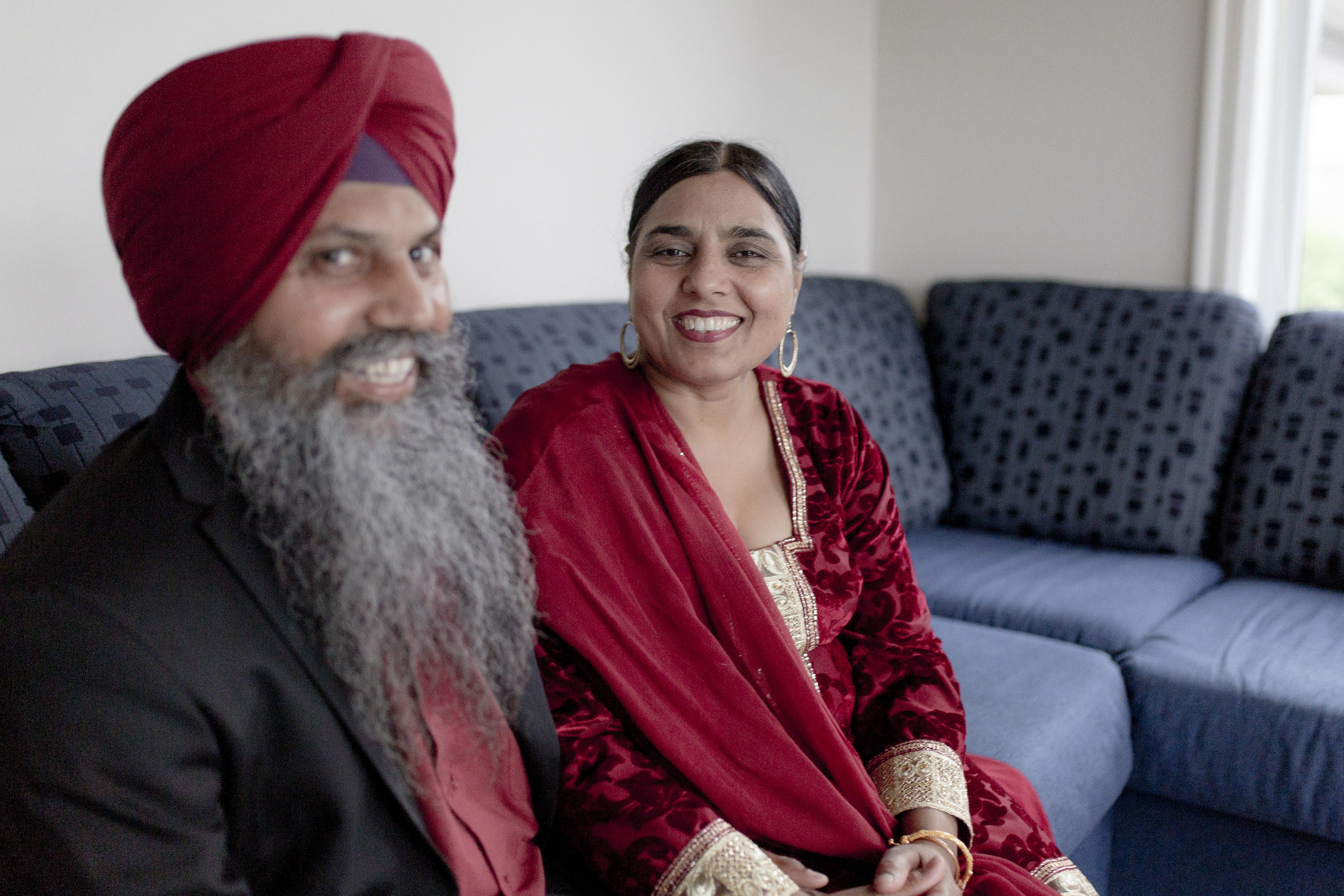 Sikh couple sat on the sofa