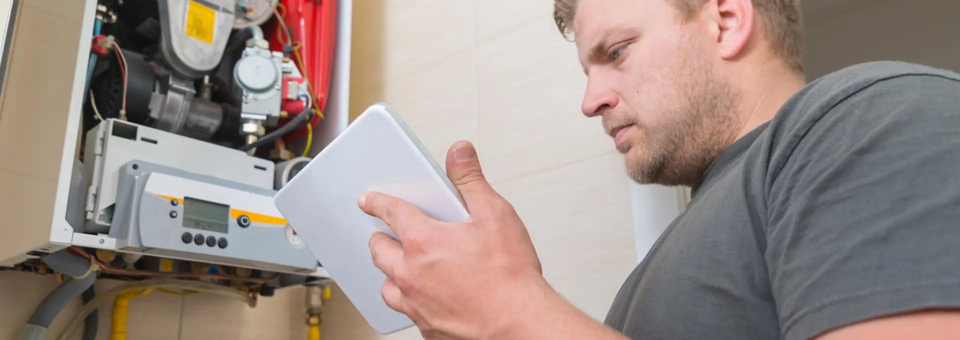 Workman servicing a boiler