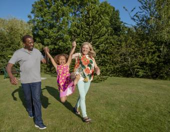 Family Playing In The Sunshine - stock