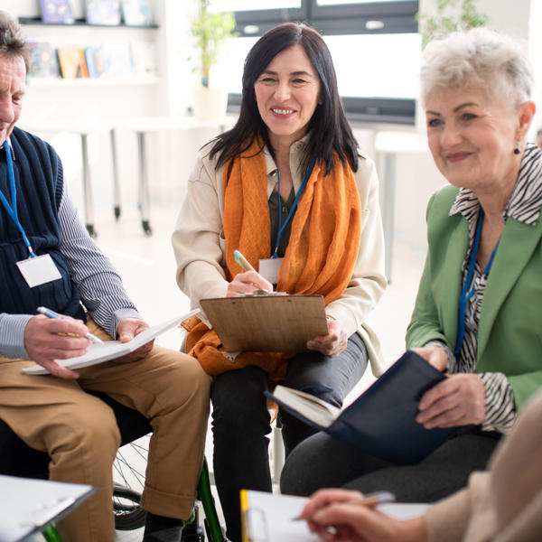 A group of people sat in a meeting