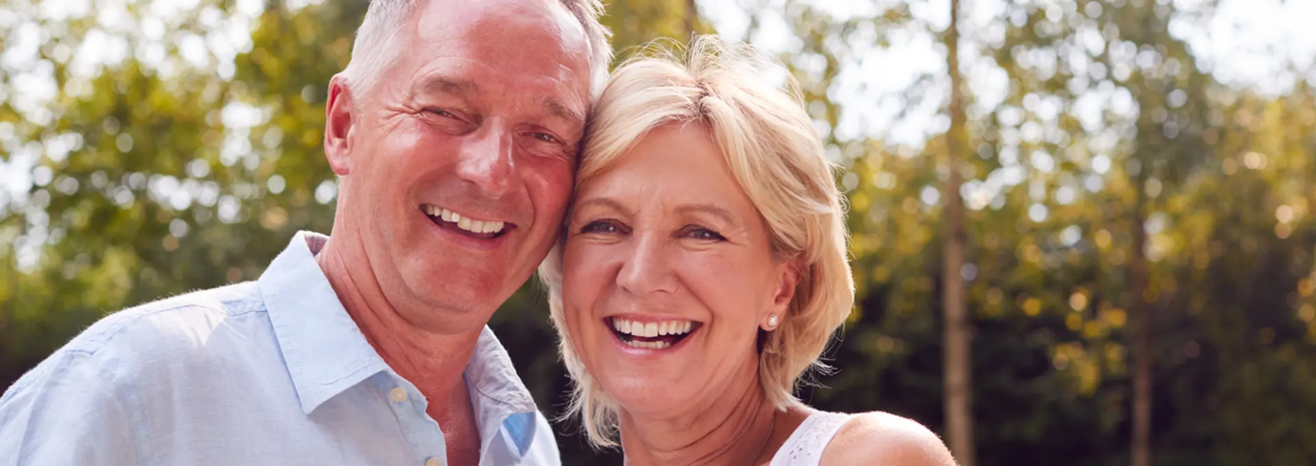Older white couple smiling - stock