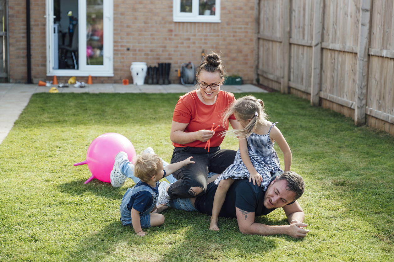 Family playing in the garden - stock
