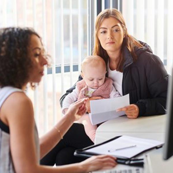 Young mother getting advice - stock