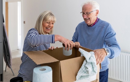 Old couple moving home - stock