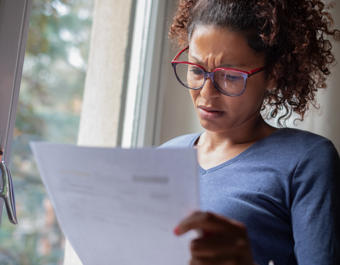Women looking confused at paperwork