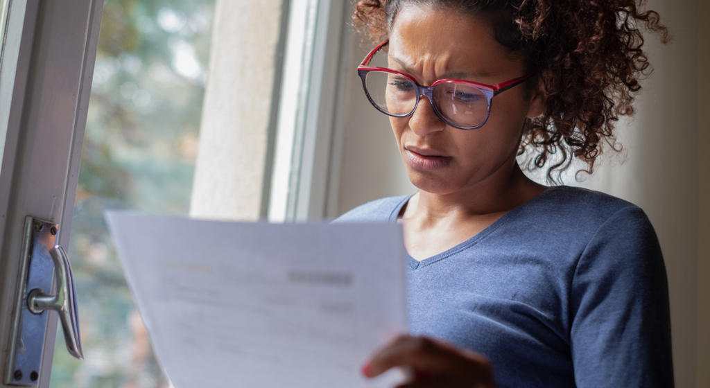 Women looking confused at paperwork