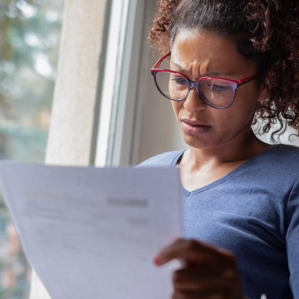 Women looking confused at paperwork