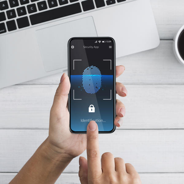 Woman Unlocking Smartphone Scanning Fingerprint For Biometric Identification