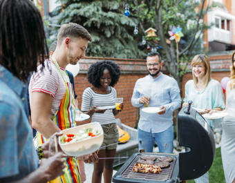 Young people having a summer barbeque 
