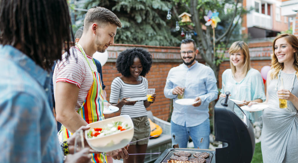 Young people having a summer barbeque 