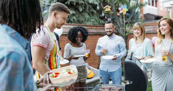 Young people having a summer barbeque