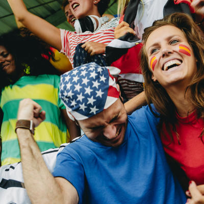 Sports Fans Celebrating Victory At A Stadium Event
