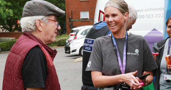 Steph Hayes speaking with resident