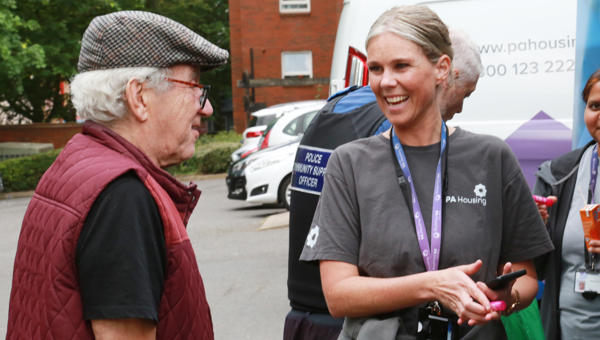 Steph Hayes speaking with resident