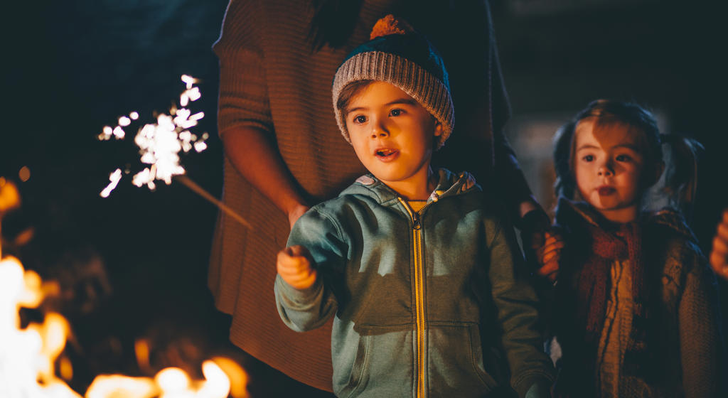 Little Boy Playing With a Sparkle