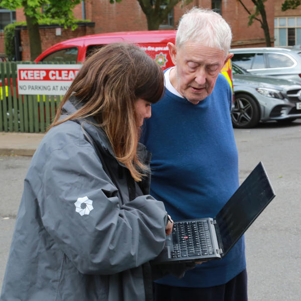 Deana Clarke speaking with resident