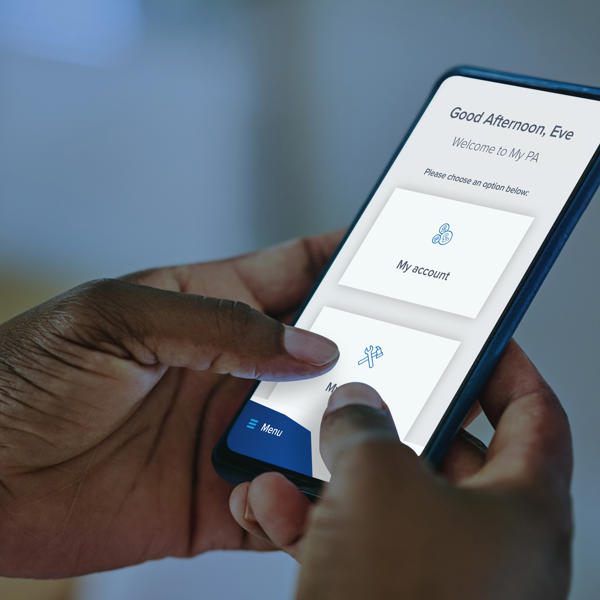 Hands holding a phone showing the My PA app in use