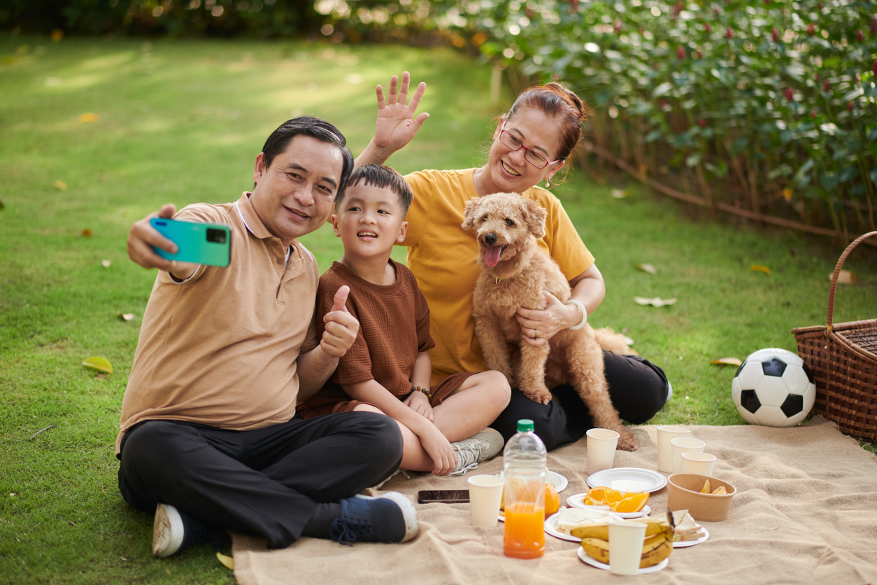 Grandparents and Grandson Taking Selfie