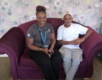 NC And Resident On Sofa