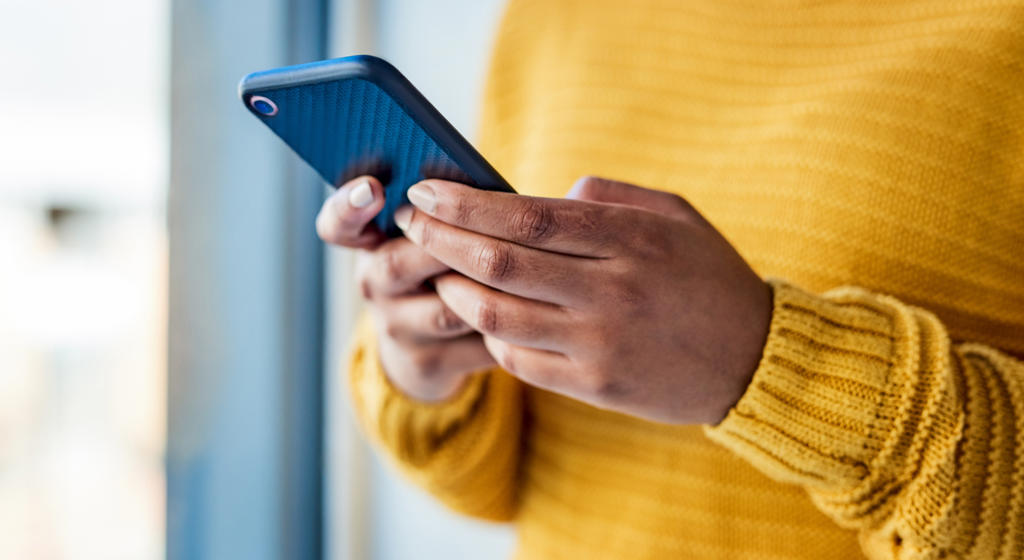 Close up of hands using a smart phone