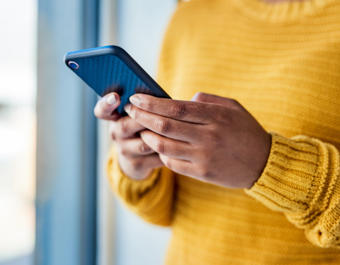 Close up of hands using a smart phone
