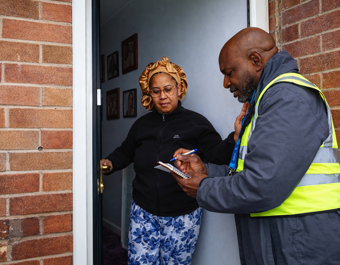 NC With Resident On Doorstep