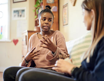 Counselling, child and psychologist woman talking