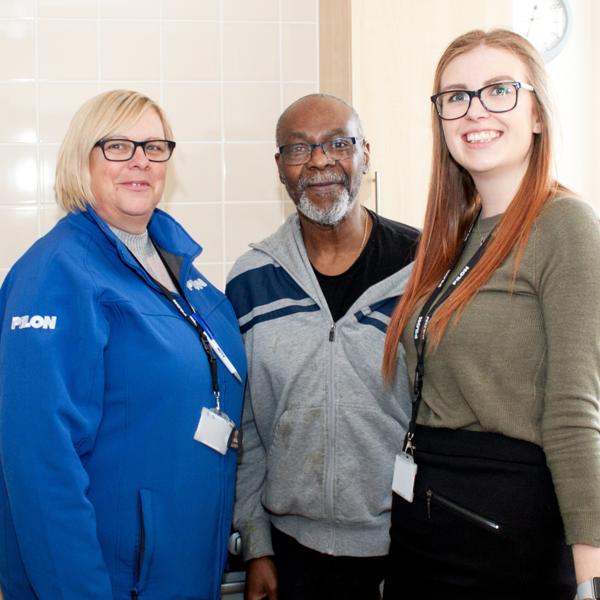 Staff posing with a resident