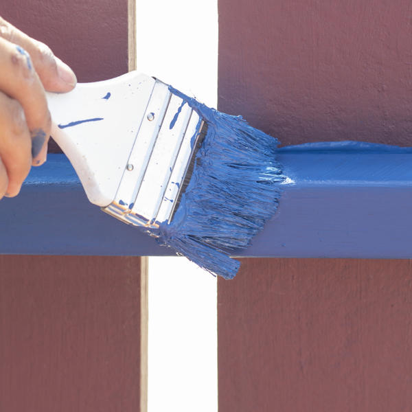 Hand Of Construction Worker Holding A Brush Painting The Fence House With Acrylic Watercolor Isolated On White Background