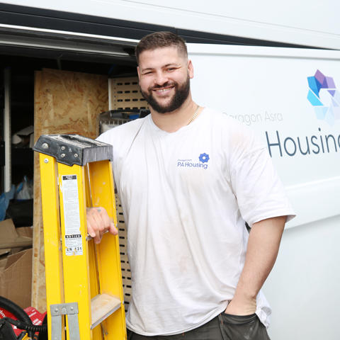 Worker holding a ladder